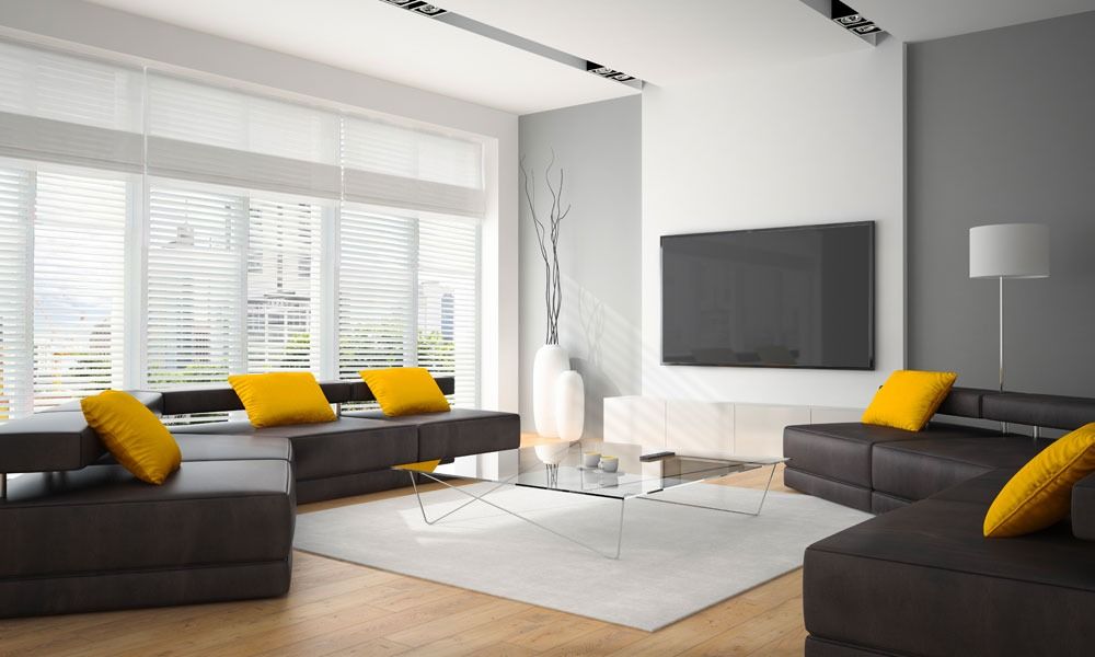 Window with partially closed gray roller shutter, white windowsill, and black wall.