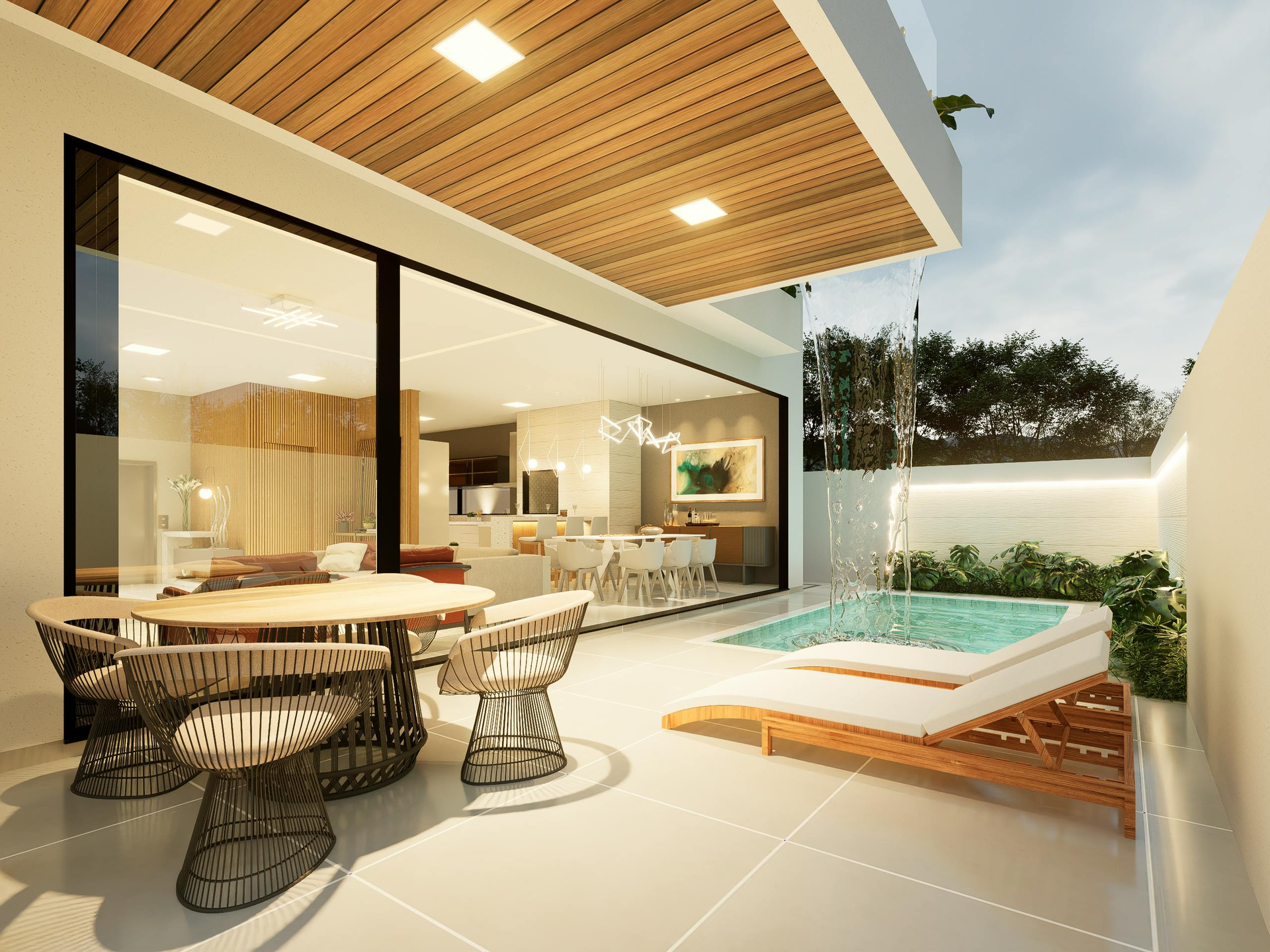 Patio with outdoor dining, small pool, and modern home interior visible through glass doors.