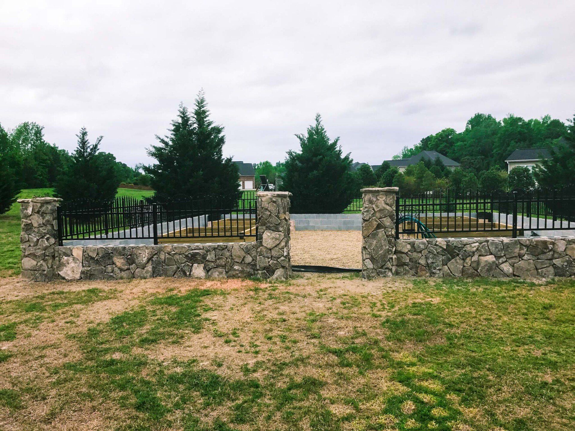 Vinyl picket fence enclosing a front yard garden