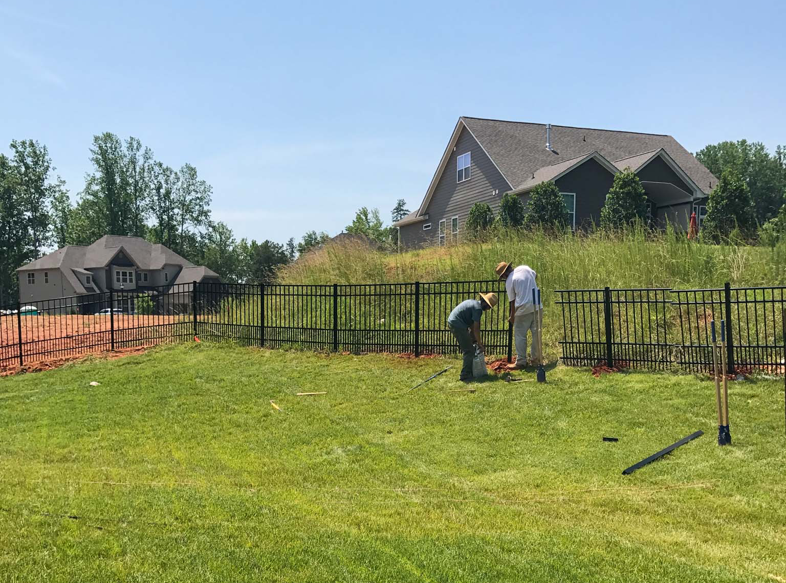 black fence in a backyard