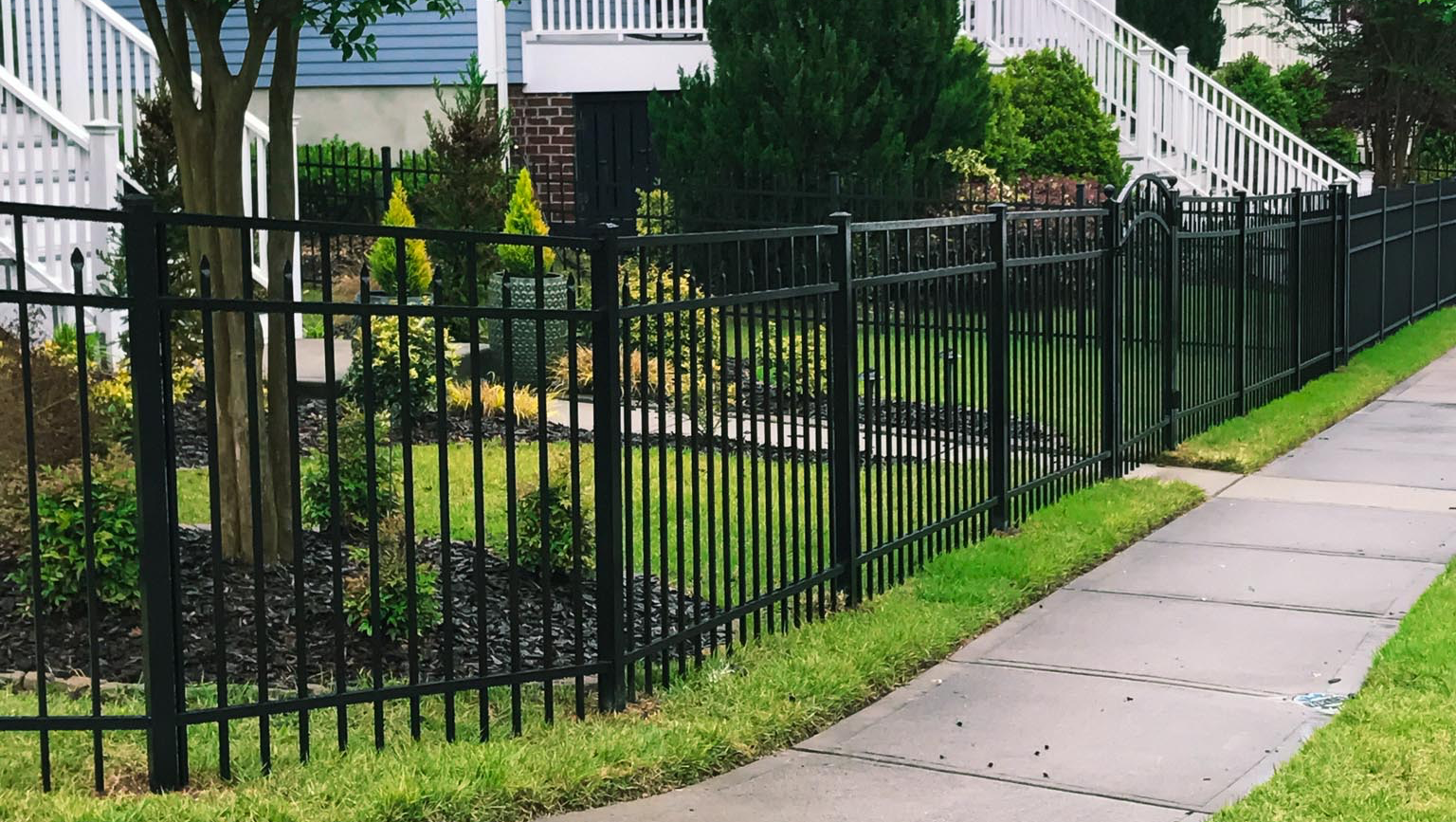 black wrought iron balusters and fence