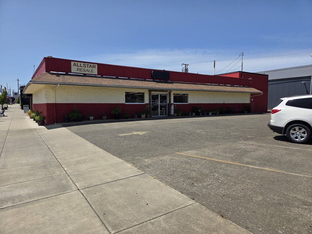 A red and tan commercial building with the sign 