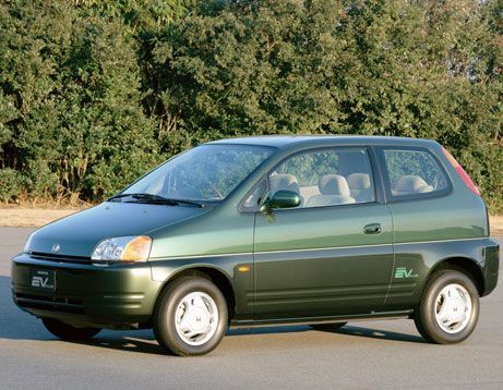 A green car with the word ev on the side