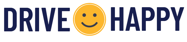 Drive Happy logo with navy text and an orange smiling face icon between the words