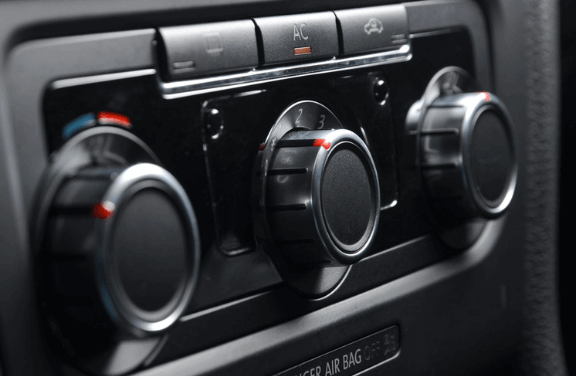 A close up of a car air conditioning control