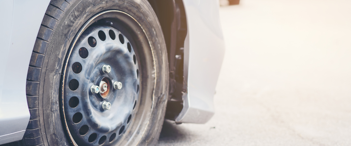 A close up of a car wheel with a tire on it.