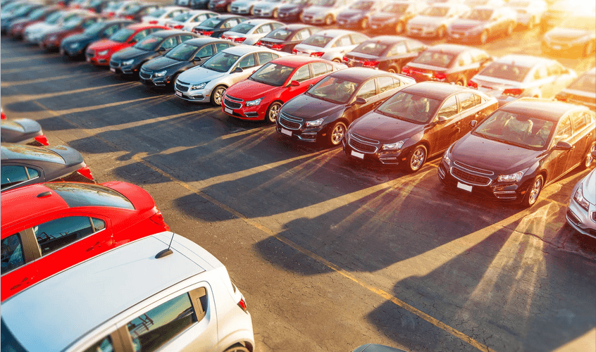 A lot of cars are parked in a parking lot