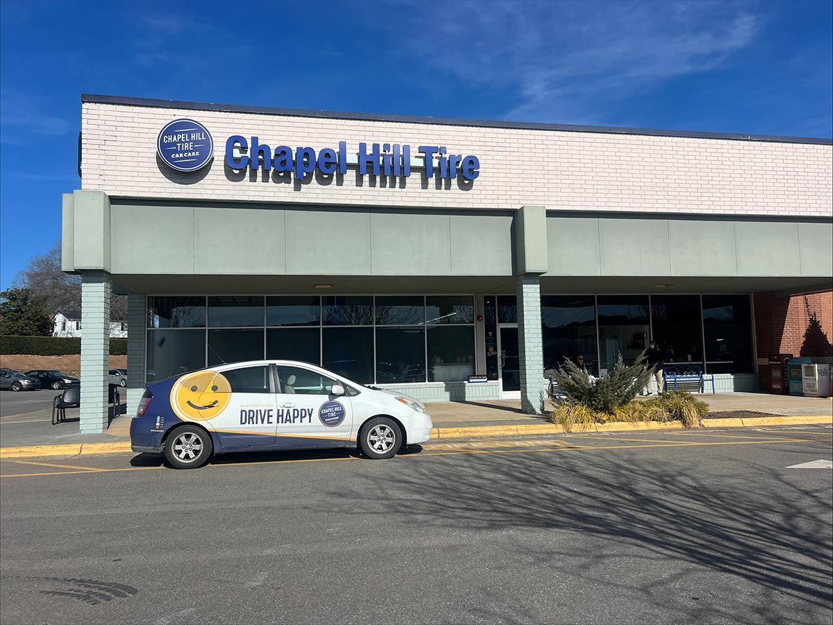 Chapel Hill Tire storefront with a car.