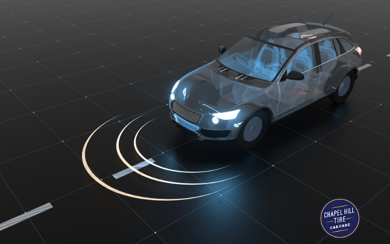 A car is driving down a road with a circle around it