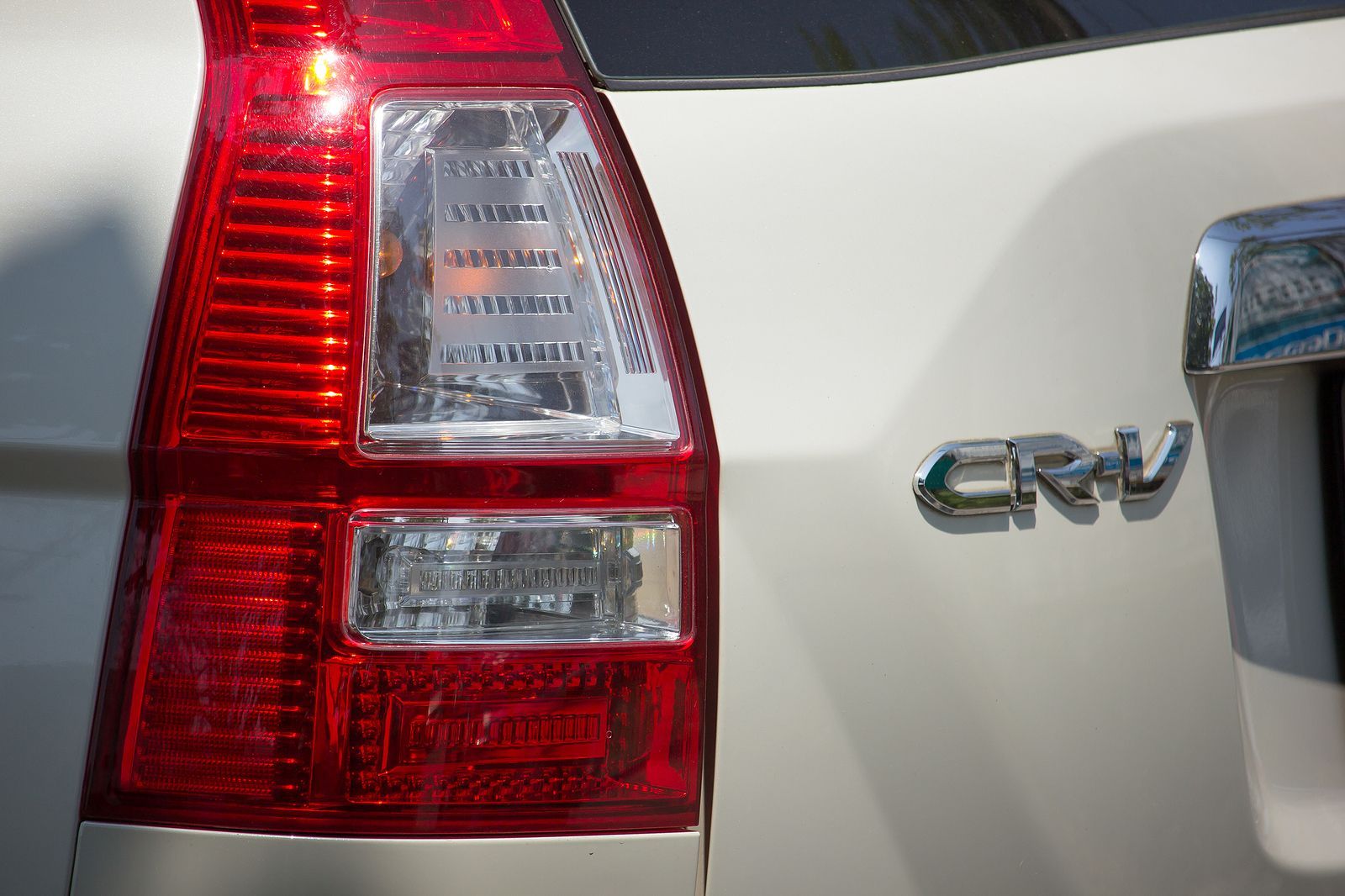 Close-up of a white Honda CR-V's taillight and