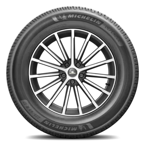 A close up of a michelin tire on a white background