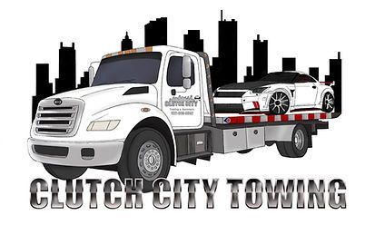 A tow truck is towing a car in front of a city skyline.