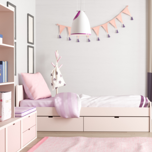 a girl 's bedroom with a white bed and pink pillows