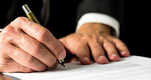 Client signing bail bond documents in Texarkana, TX