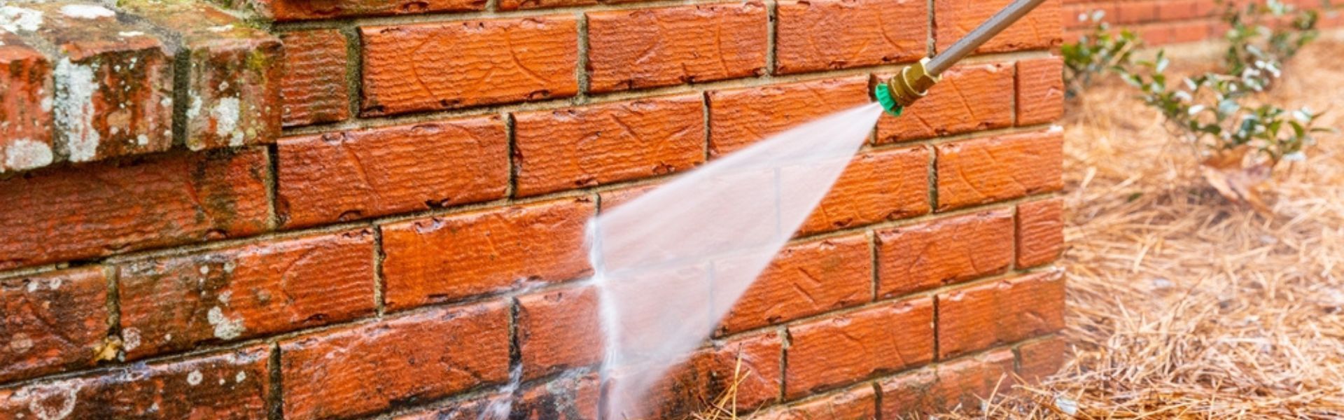 Power washing a house to boost beauty and property value.