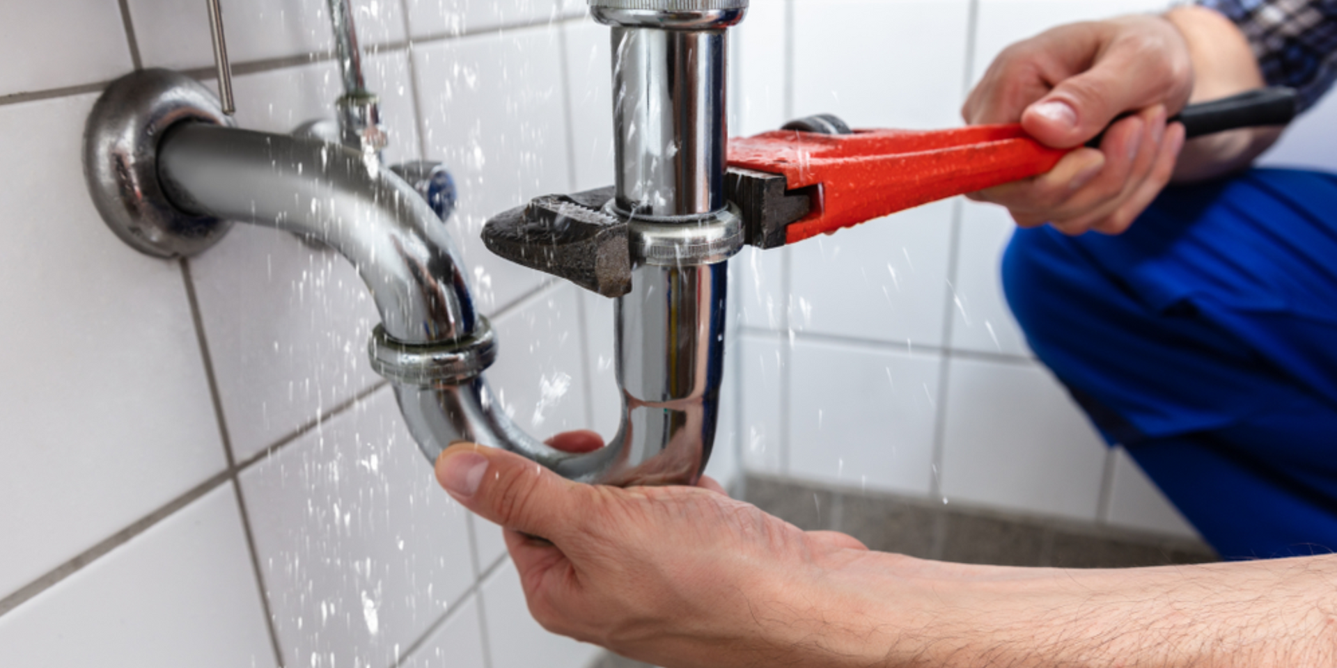 Technician repairing water damage in a residential home with professional equipment.
