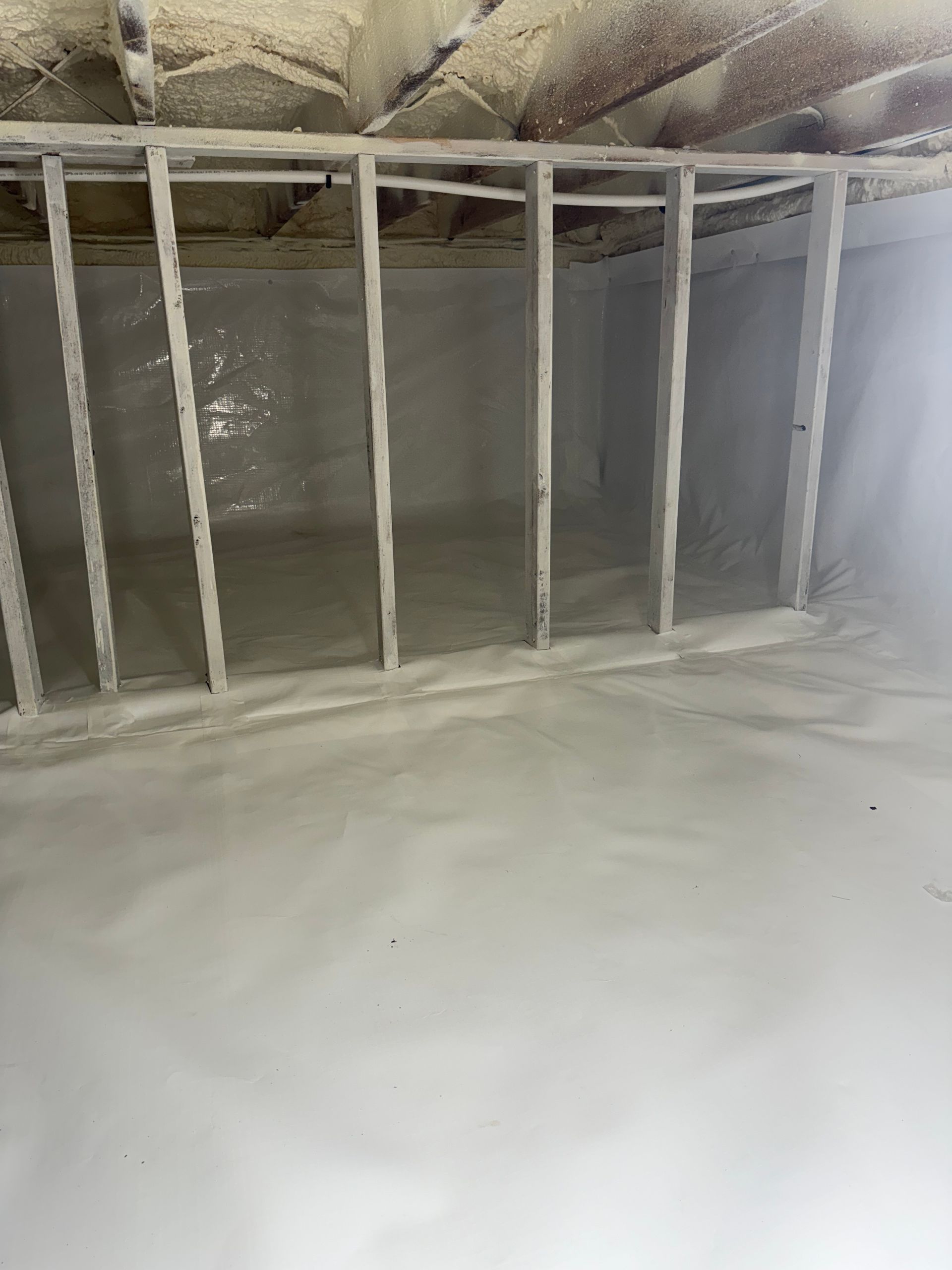A basement with a lot of foam on the floor and walls.