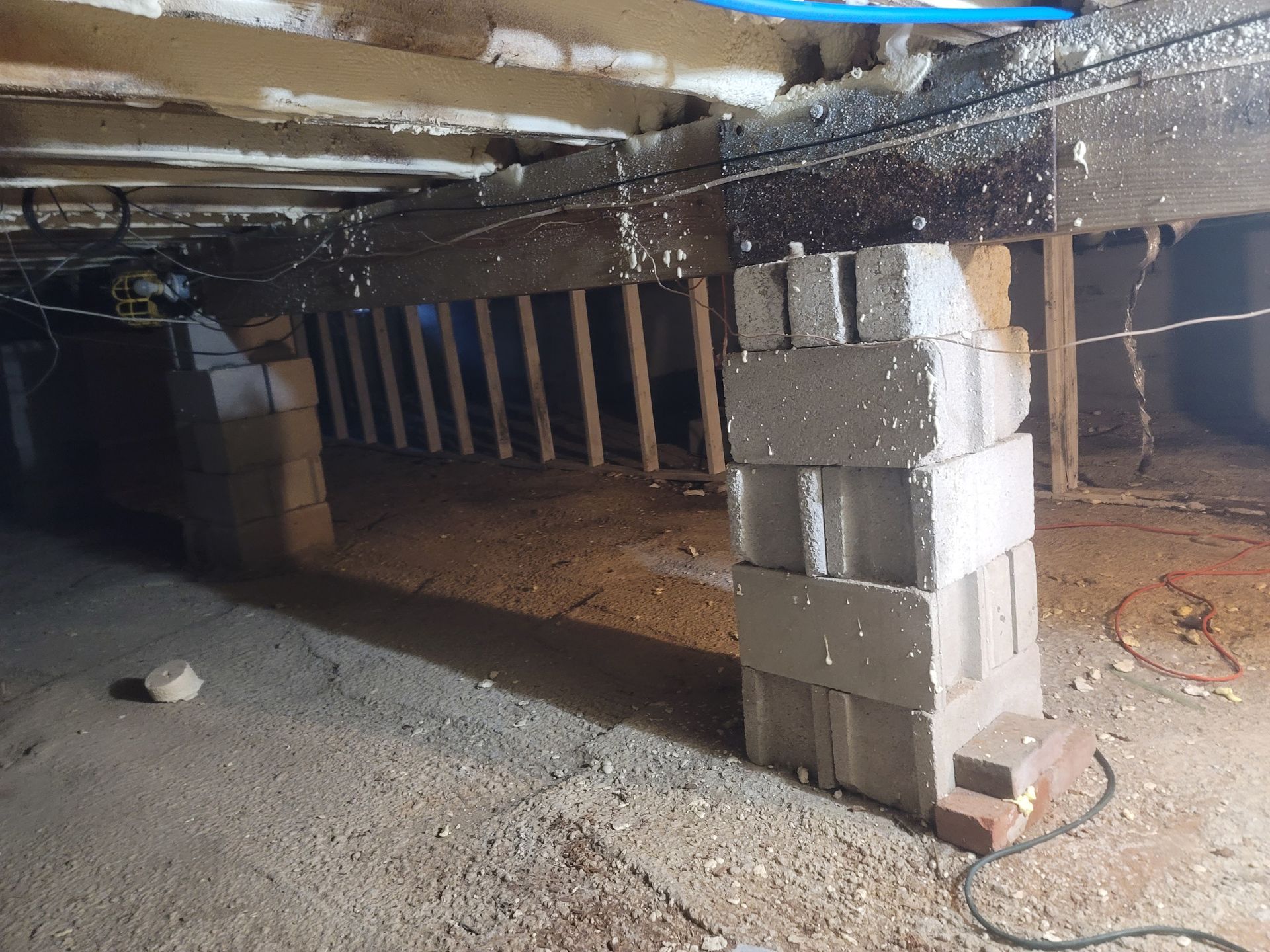 A bunch of bricks are stacked on top of each other in a room