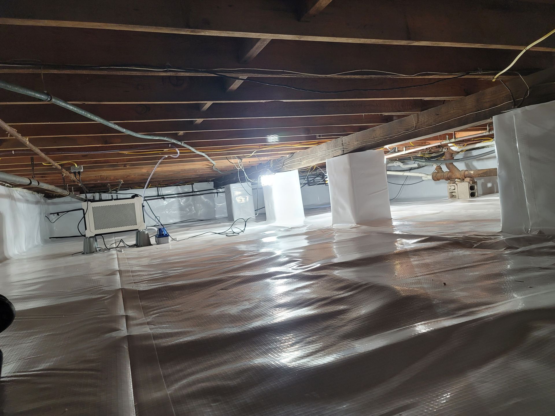 A very large room with a lot of electrical wires hanging from the ceiling.