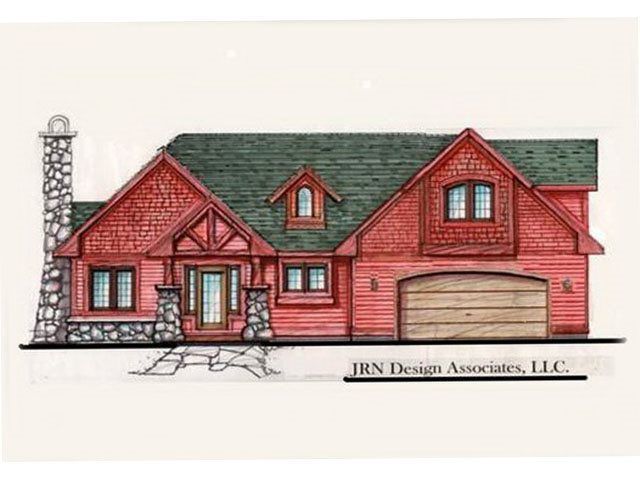 Red-painted house with stone chimney, green roof, and attached garage. 