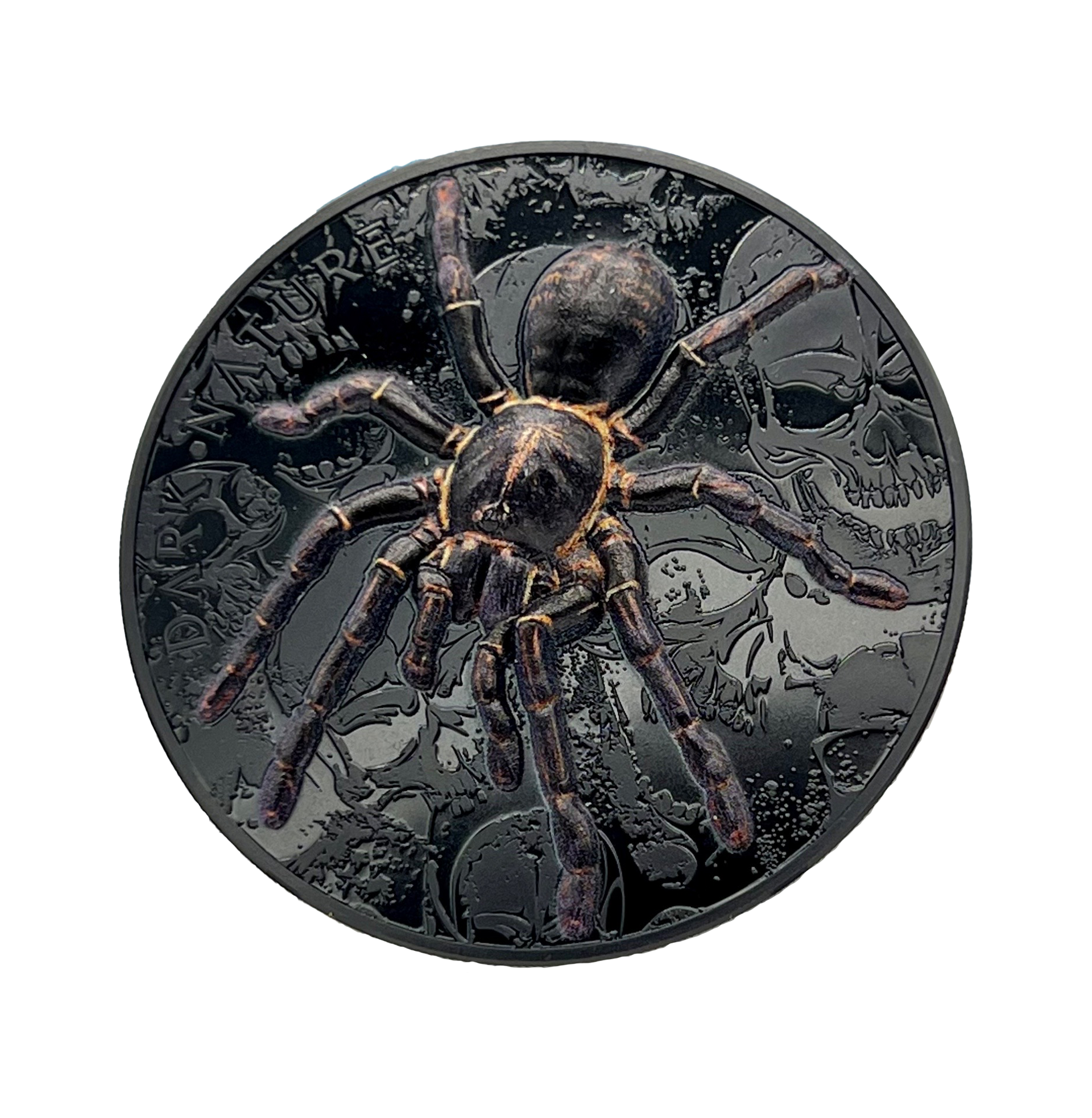 A black coin with a spider on it on a white background.