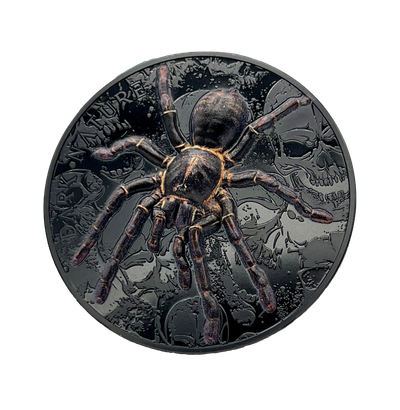 A black coin with a spider on it on a white background.