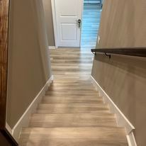 A set of stairs leading up to the second floor of a house.