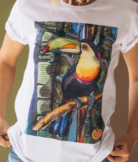 White t-shirt with a colorful DTF (Direct To Film) printed toucan illustration perched on a branch.