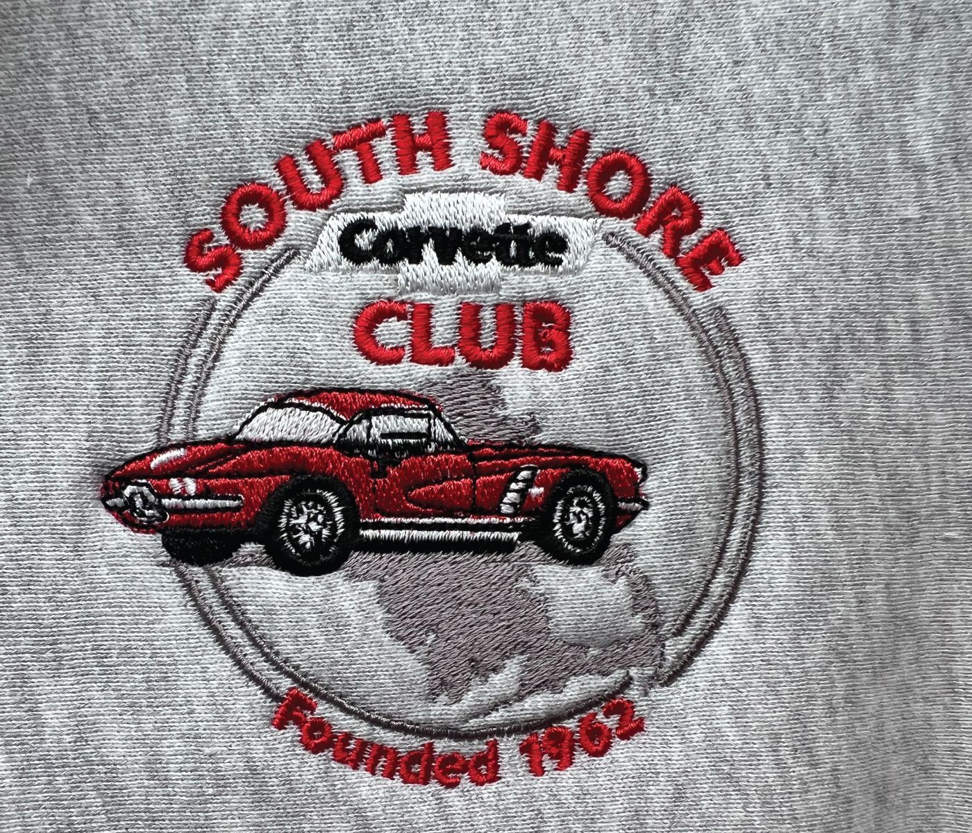 Custom embroidered club logo: South Shore Corvette Club with a red Corvette car inside a circle, on a gray fabric.