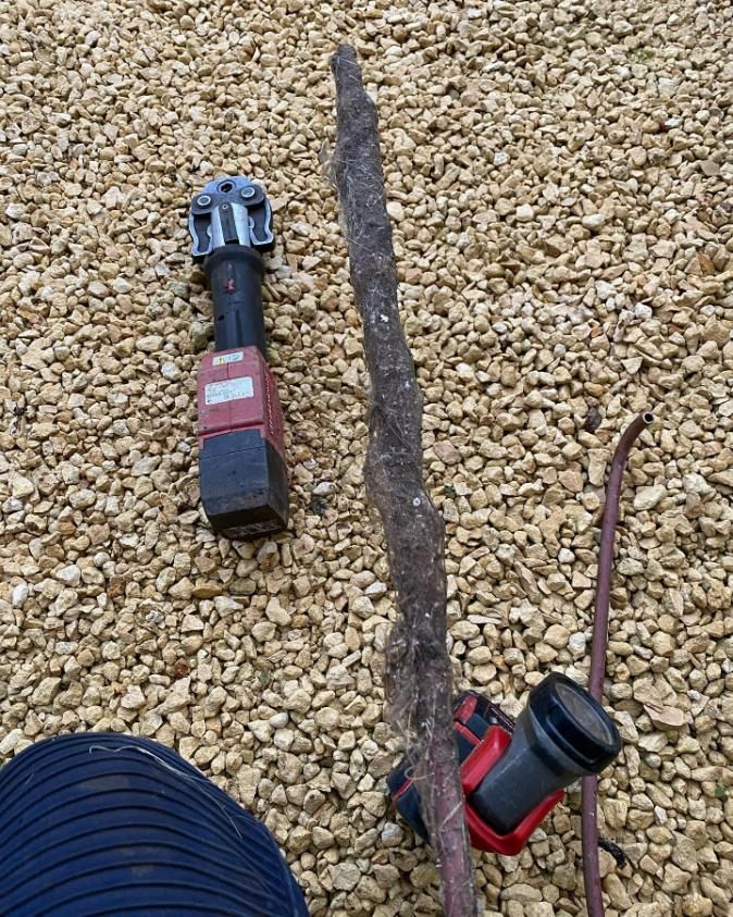 Tool is Sitting on a Pile of Gravel Next to a Stick — ASAP Local Plumbing in Warrnambool, VIC