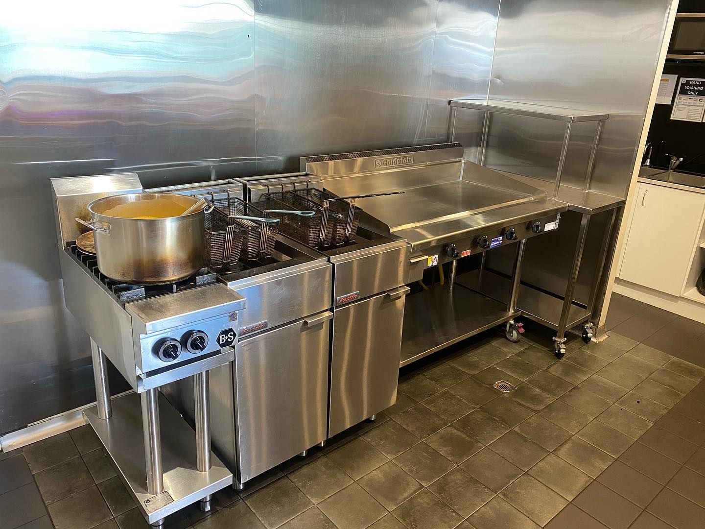 Stainless Steel Kitchen Cabinet With A Pot Of Soup On The Stove — ASAP Local Plumbing in Warrnambool, VIC