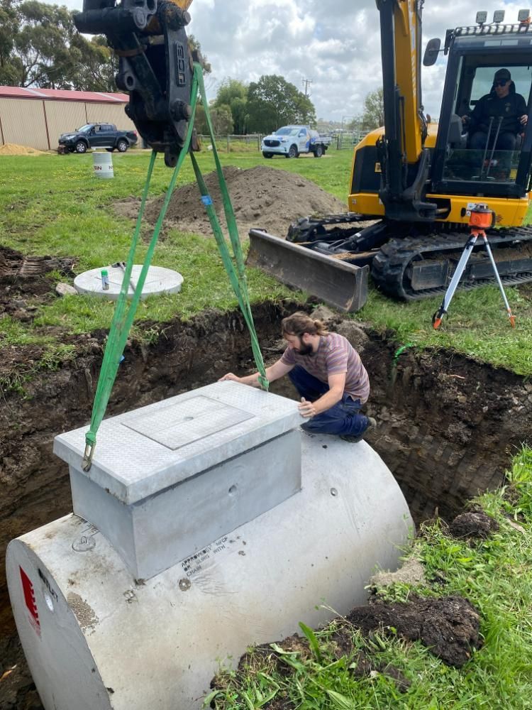 Large Concrete Tank Is Being Installed With Excavator Inside the  Trench In Ground — ASAP Local Plumbing in Warrnambool, VIC