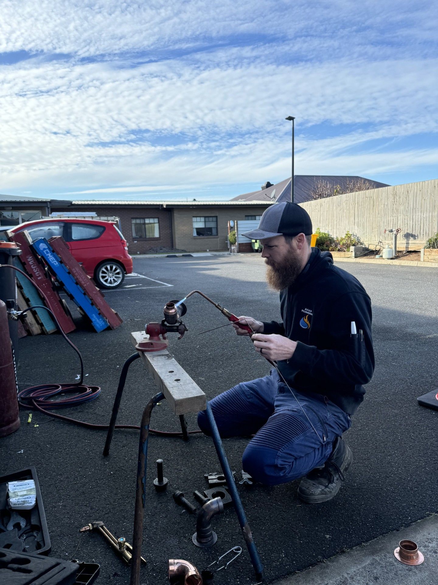 Man is Fixing a Water Heater in a Bathroom — ASAP Local Plumbing in Warrnambool, VIC