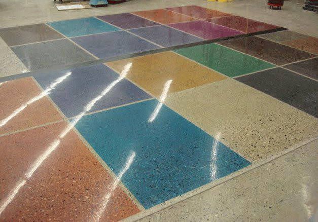 Colorful, glossy concrete floor tiles in various colors arranged in a grid.