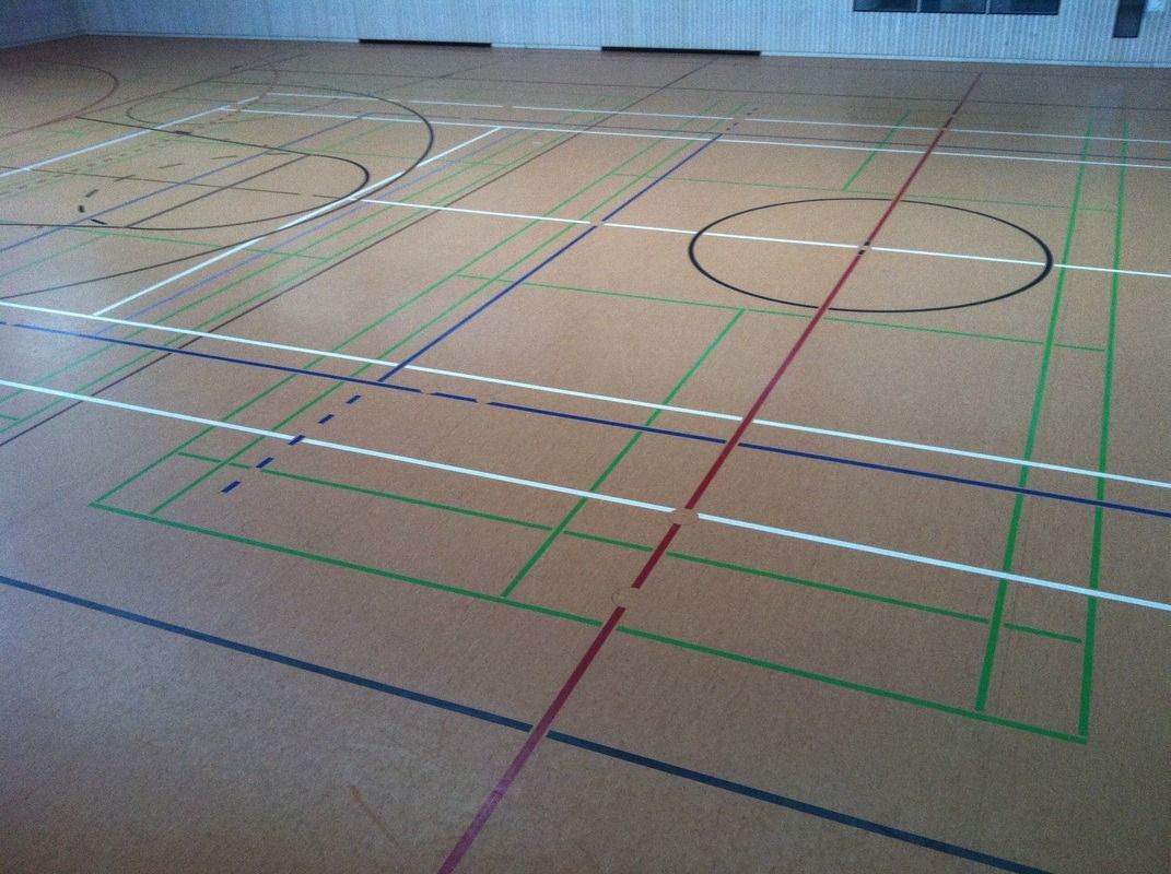 A basketball court with a circle in the middle of it, on a Hart's Athletic installed floor.