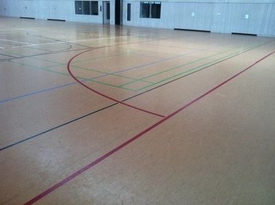 A basketball court with a few lines on it, on a Hart's Athletic installed floor.