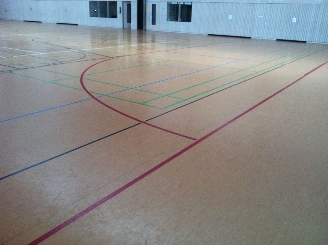 A basketball court with a few lines on it, on a Hart's Athletic installed floor.