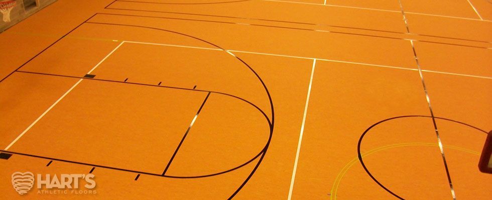 A basketball court with a few lines on it, on a Hart's Athletic installed floor.