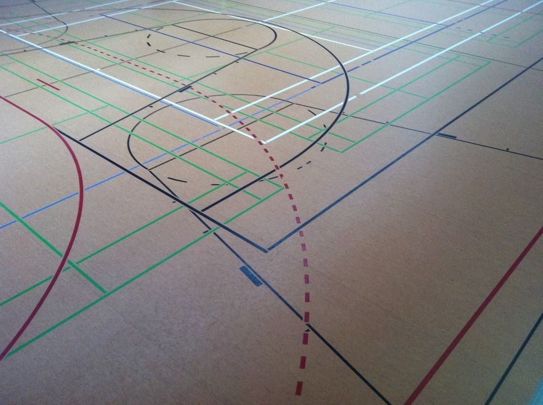 A basketball court with a few lines on it, on a Hart's Athletic installed floor.