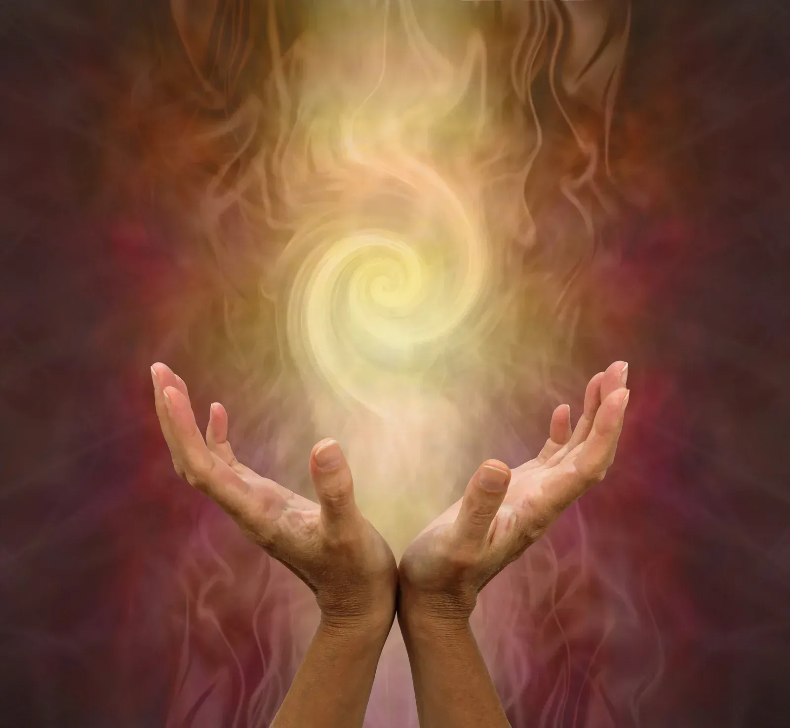 A person is holding their hands up in front of a swirl of light coming out of them.