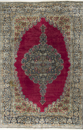 A red rug with a floral pattern on it is on a white background.