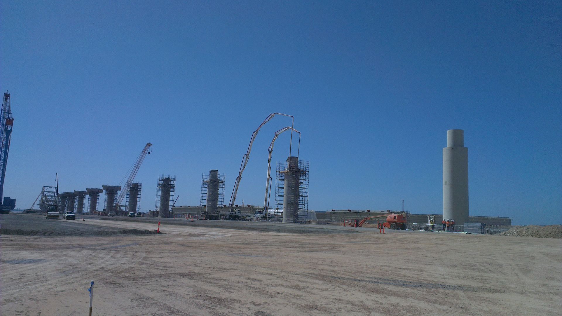 A construction site with a blue sky in the background