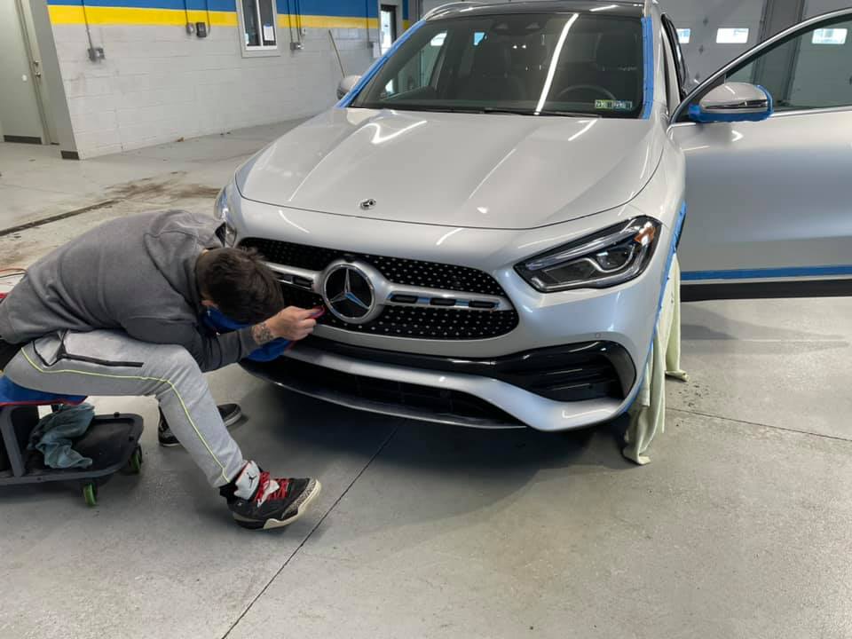 Man Checking the Car — Erie, PA — Sparkle Clean Car Care