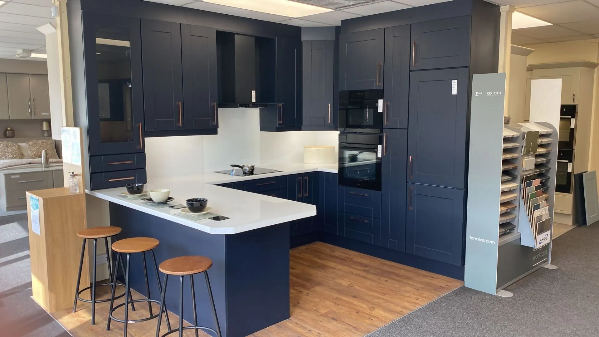 showroom display of a navy blue kitchen