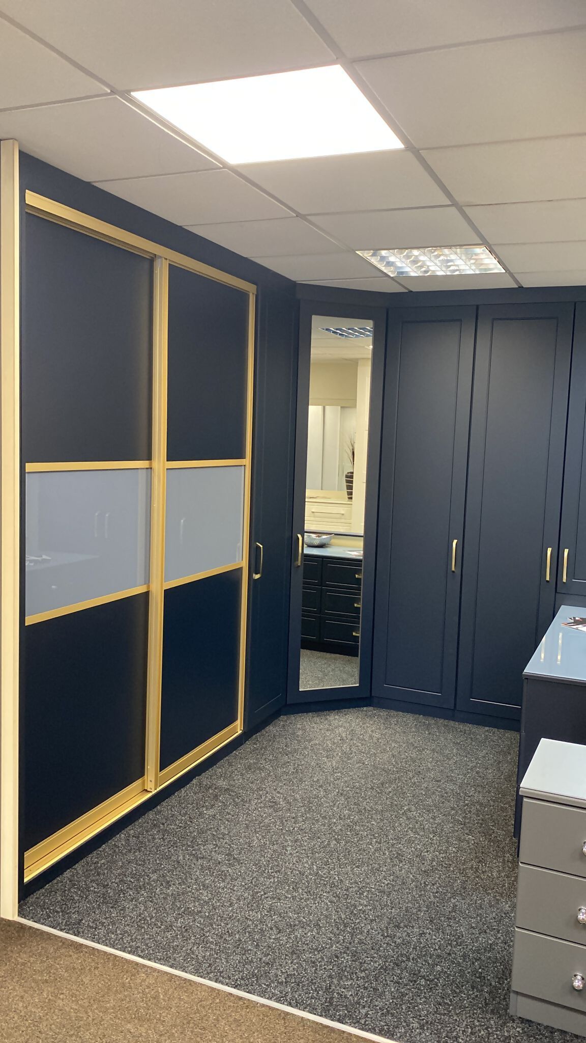 Pencil routed indigo blue with gold framed sliding doors 1