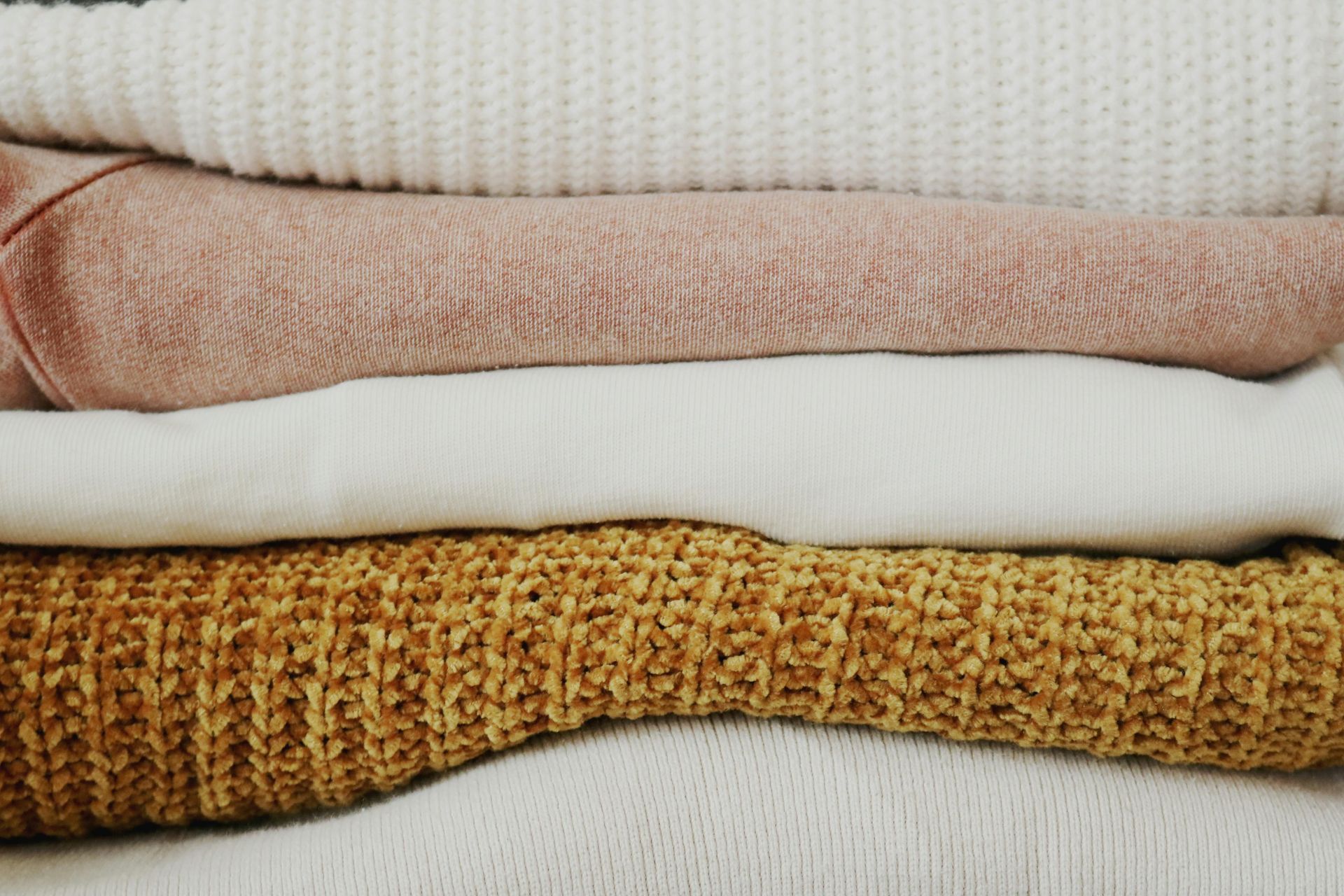 Stack of Sweaters at Local Dry Cleaners