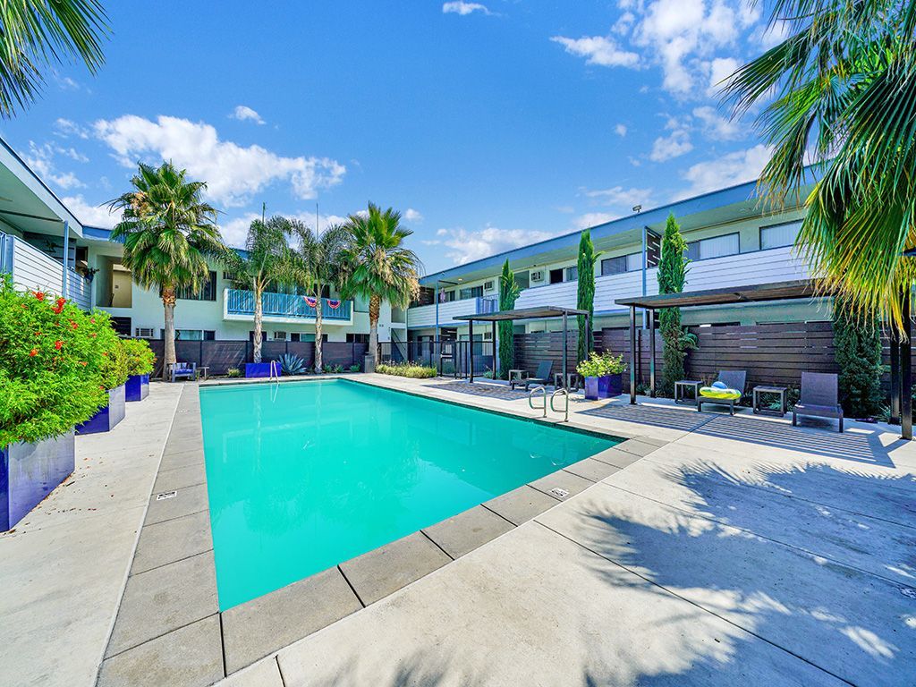 Photo of a pool surrounded by the apartment community