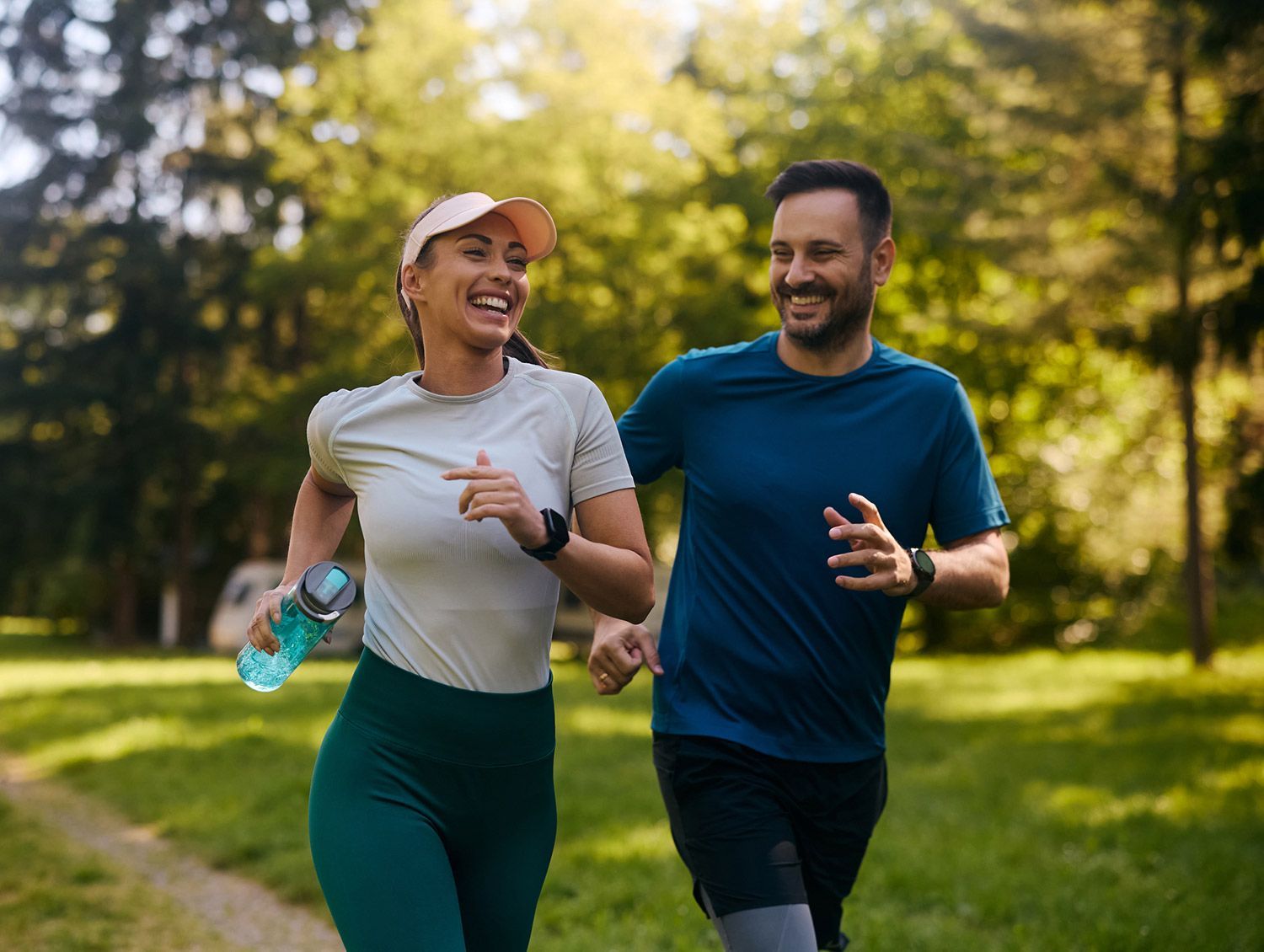 Healthy couple running on park