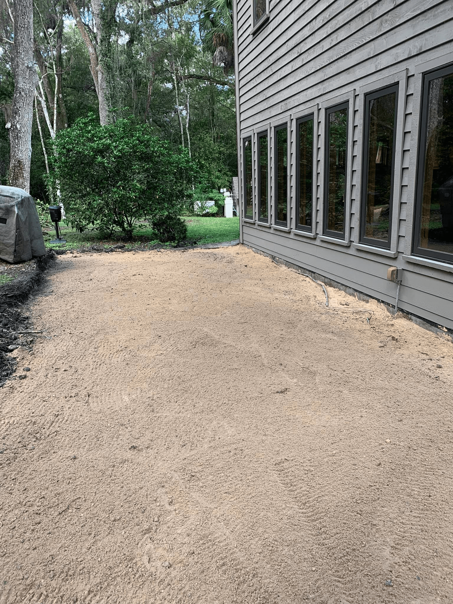 Dump trucks service and layer of sand added to property in Ocala, FL.