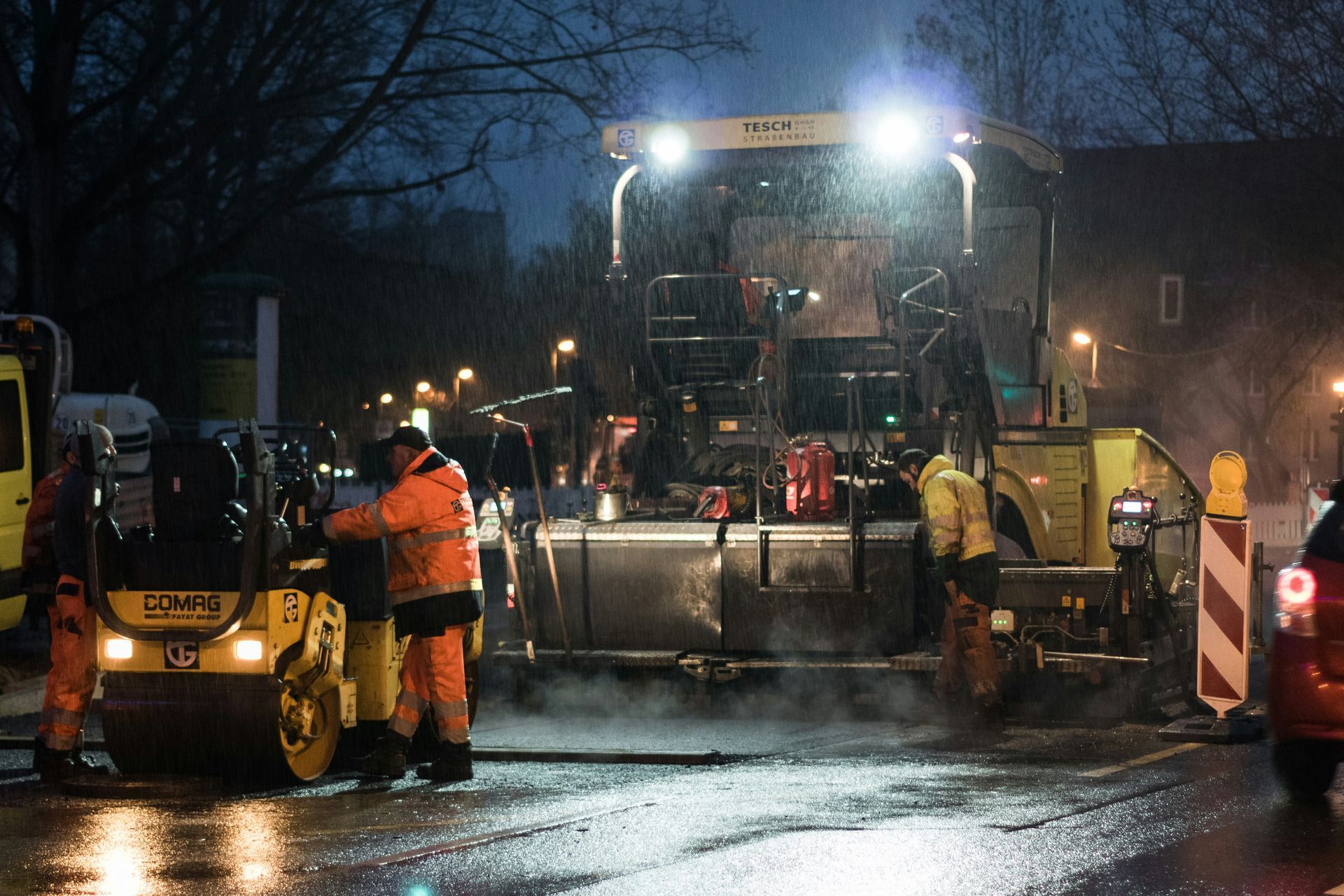 Asphalt crew working at night